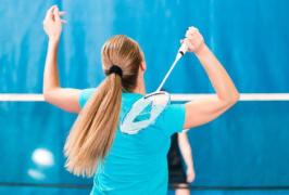 woman playing badminton